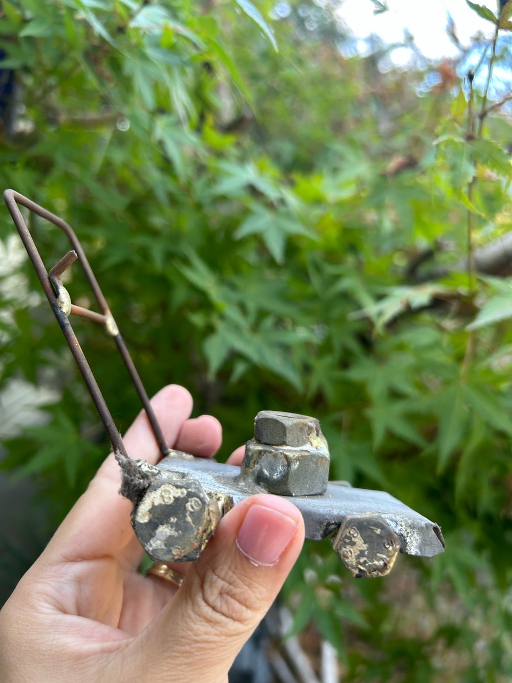 handcrafted miniature sculpture a push lawnmower made from recycled scrap metal